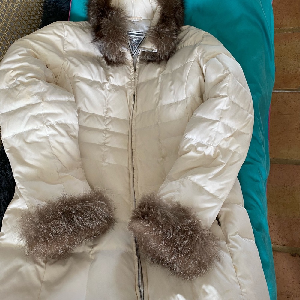 Quilted down jacket with fur cuffs and neck.